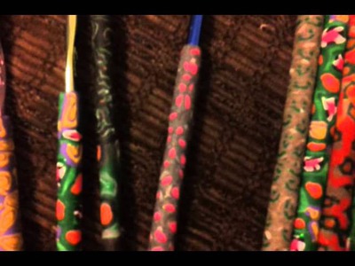 Crochet hooks and pens covered in polymer clay!