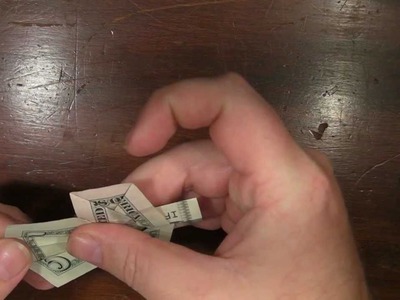 Origami Cross with a US five dollar bill