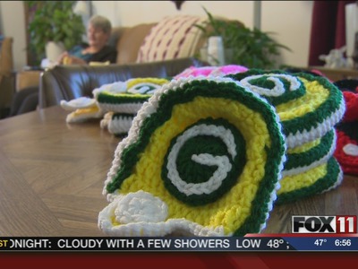Mishicot woman helps recruit Packers fans with baby hats