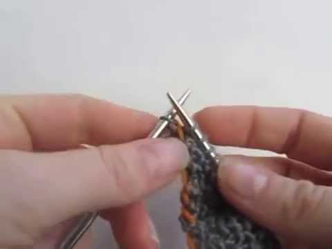 How to carry unused yarn across thick stripes