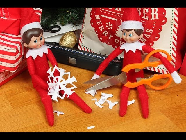 Elf on the Shelf makes paper snowflakes - origami