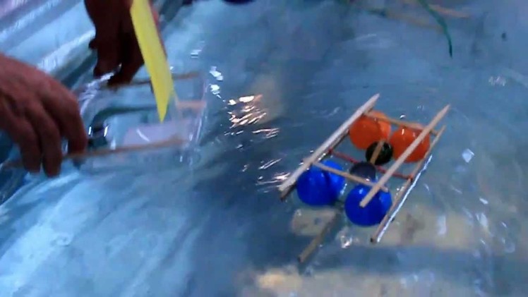 Rubber band powered water craft