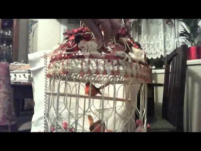 Shabby chic decorated bird cage with lights