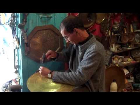 Crafting brass plates by hand in Chefchaouen, Morocco