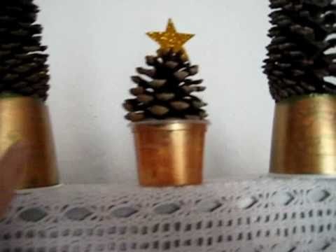 Christmas. Arts and Crafts decoration: Disposable cups, pinecones and star shapes to make trees.