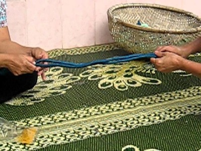 Women twisting scarves at Craft Link in Vietnam