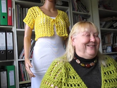 Yellow short shrug and lots of beads and scarves