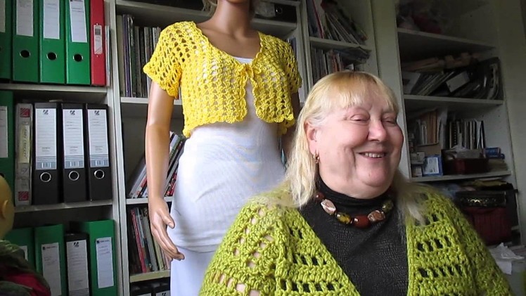 Yellow short shrug and lots of beads and scarves