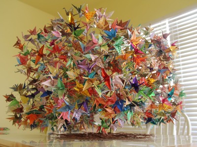 Construction of 1000 origami folding paper cranes on a wired tree