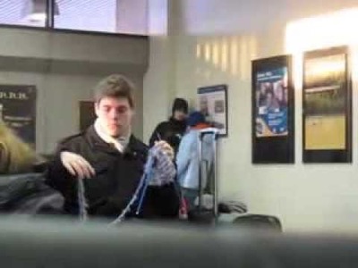CANDID VIDEO OF YOUNG MAN KNITTING IN TRAIN STATION