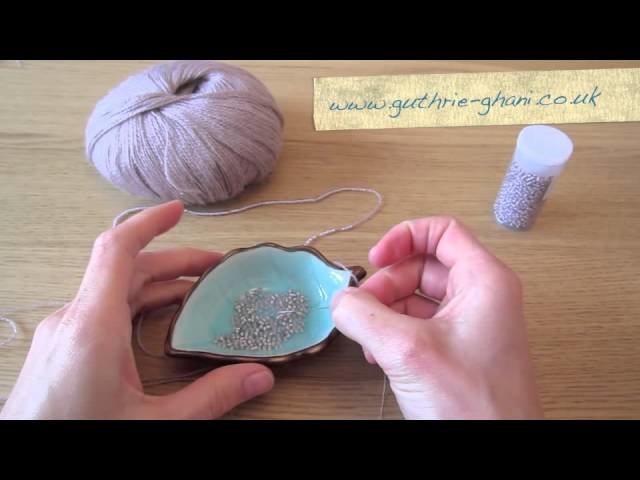 How to thread beads onto yarn