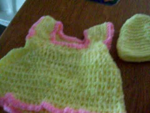 A Crochet Baby Dress And Hats
