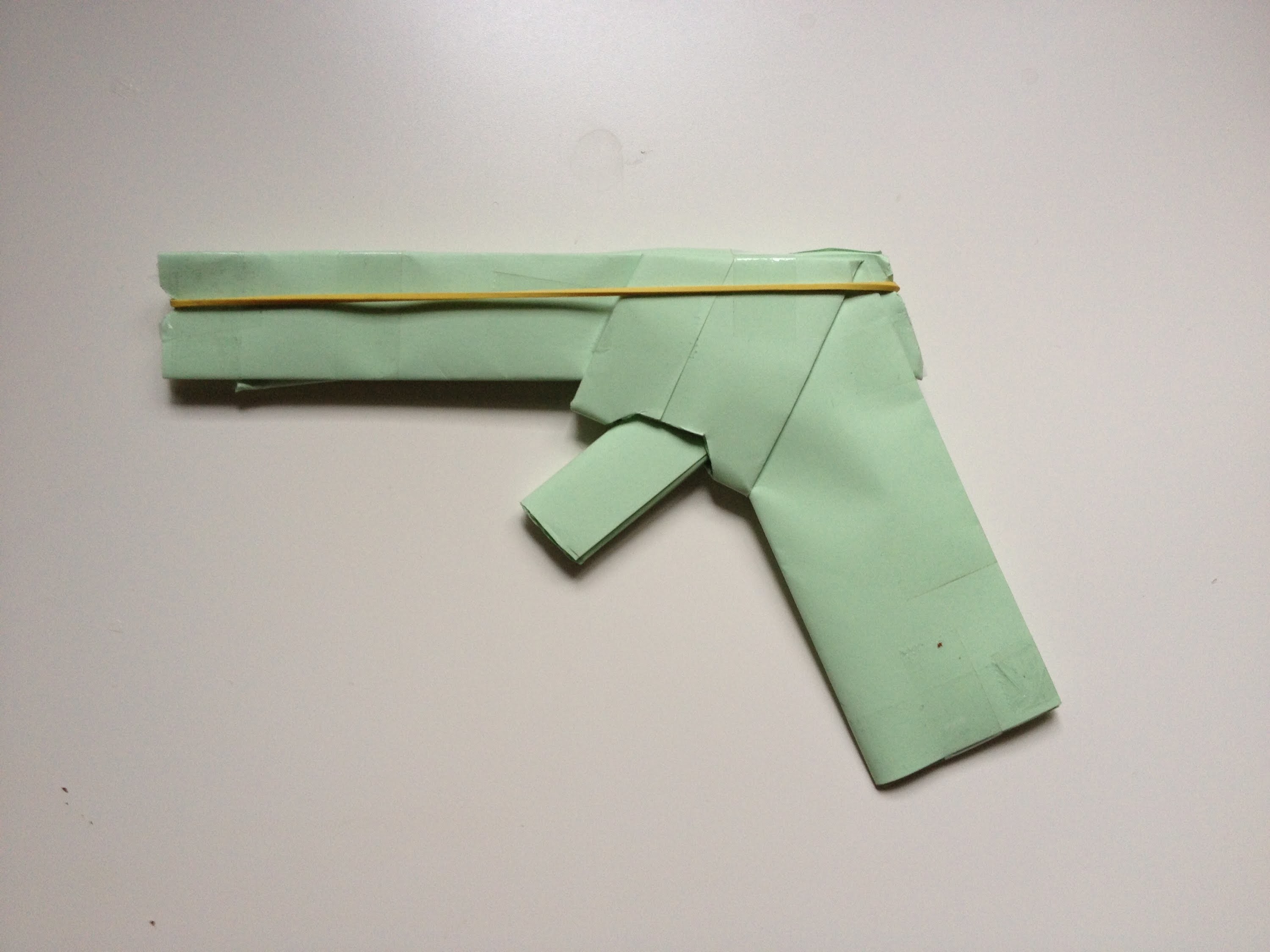 How To Make A Paper Gun That Shoots Rubber Bands (With Trigger). (Easy) (HD)