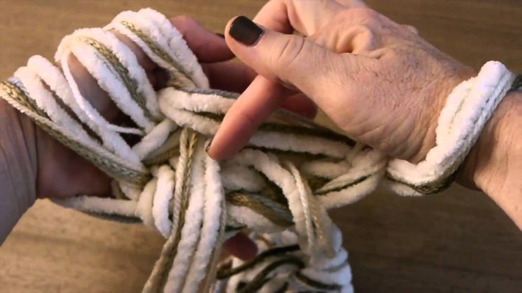 How to Arm Knit a Purl Stitch