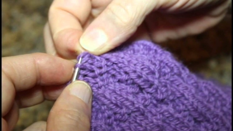 How to fix a (serious) mistake by unraveling the knitting and reclaiming the live stitches.