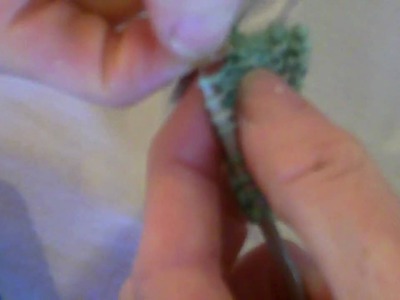 Knitting beads with dental floss.MP4