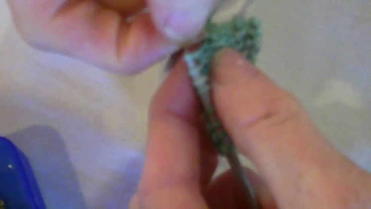Knitting beads with dental floss.MP4