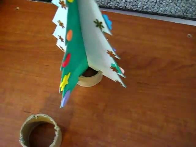 Christmas.Arts and crafts: Painted cardboard stand-up trees activity. Add stars or stickers.