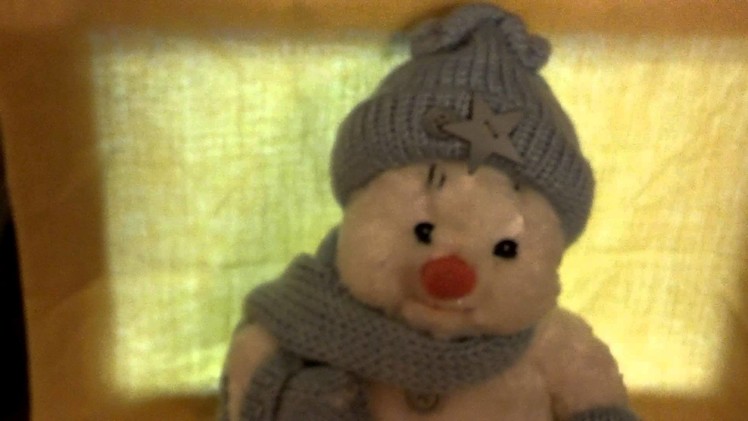 Snowman with Knitted hat, scarf and mittens