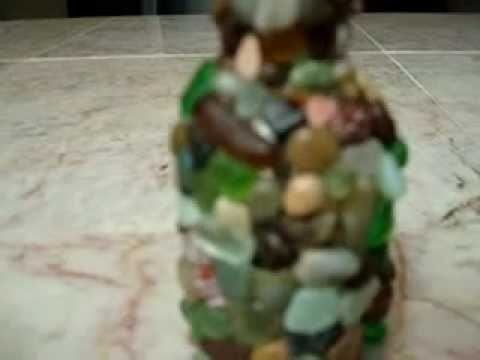 Miniature glass bottle decorated with tiny sea pebbles and sea glass gems diy craft