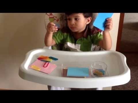 Moksh in a Montessori Practical Life Activity with paper pins. U Pins (DIY Activity)