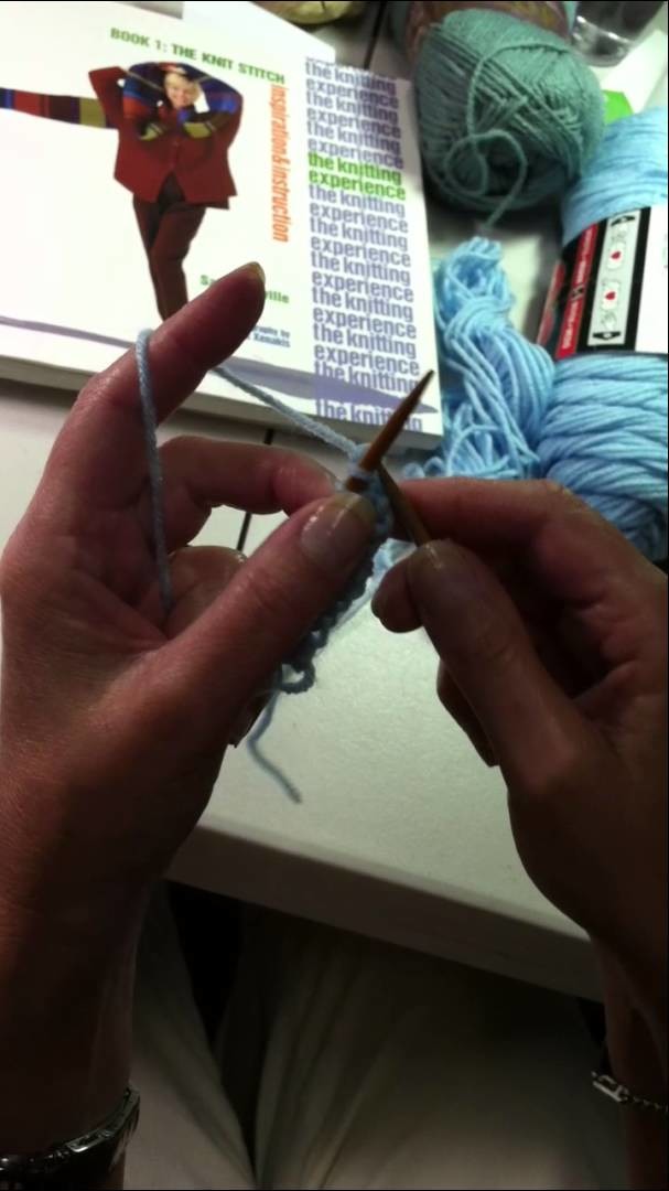 Beginning knitting lesson with experienced teacher