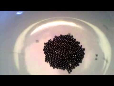 ASMR pouring tiny candy beads in bowl (w14)
