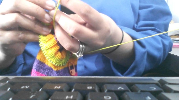 Knitting on 9"circular needles, how I hold them