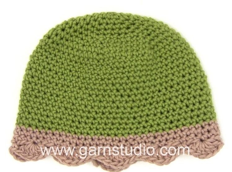 DROPS Crocheting Tutorial: How to work a Christmas hat with a crochet edge.
