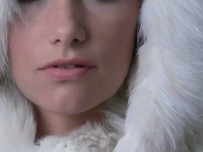 Lady in knitted fur coat with big fur hood