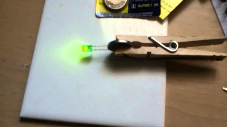 Make an LED light on a coin battery