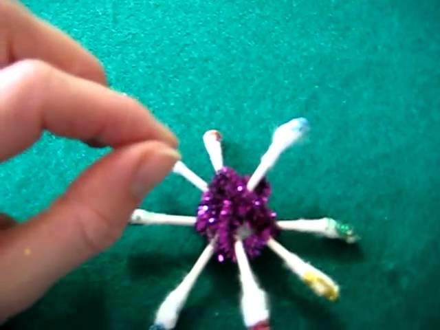 Christmas. Arts and Crafts activity: Q-tip, glitter and shiny pipe cleaner stars