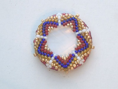 BeadsFriends: Beaded bezeled mother of pearl disc with Peyote Stitch (Star Bead Pattern)