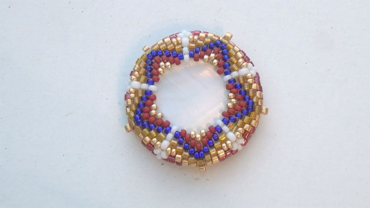 BeadsFriends: Beaded bezeled mother of pearl disc with Peyote Stitch (Star Bead Pattern)