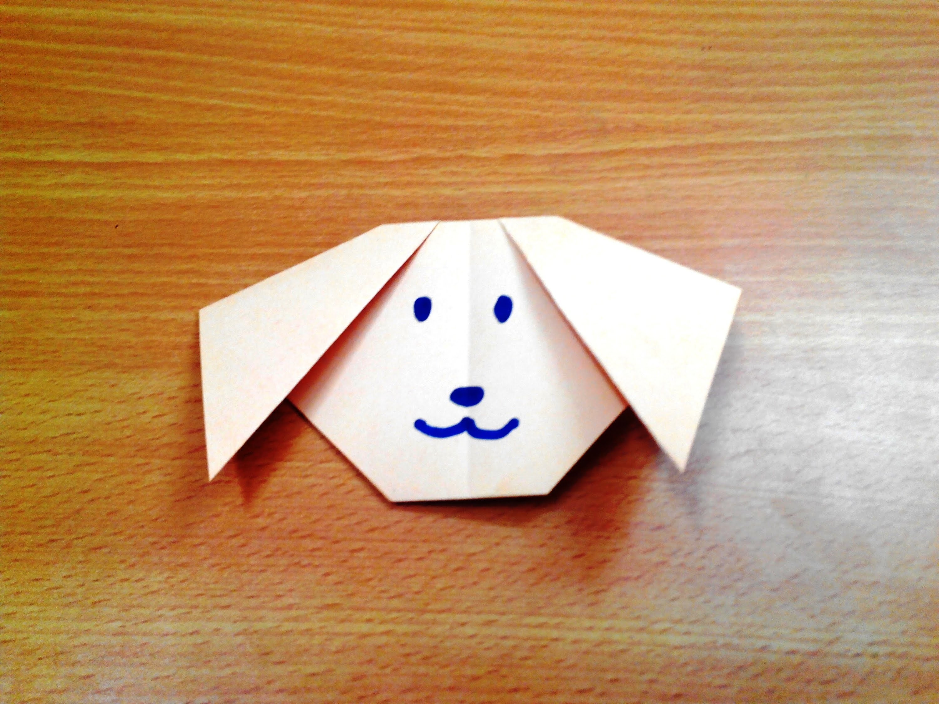 How to make an origami dog face step by step.