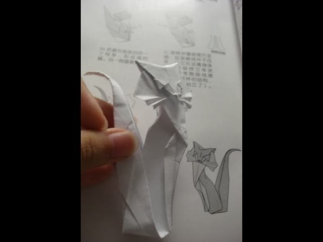 Origami cat instruction designed by Roman Diaz