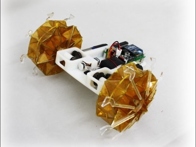 Origami wheel robot base on magic-ball origami structure