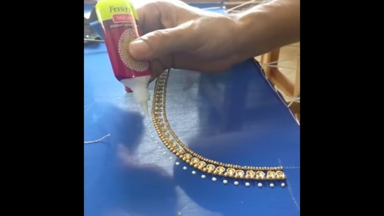U neck design with golden beads for a party wear blouse