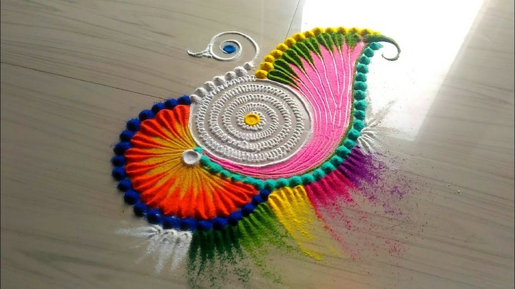 Innovative and multicolored rangoli designs.easy and simple rangoli design by jyoti Rathod