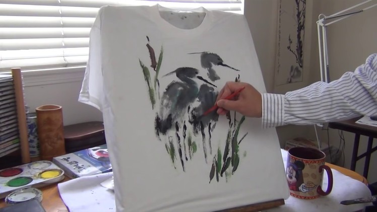 Henry Li showing how to paint a T-shirt with liquid acrylic paints