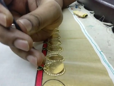 Coin design for a saree border