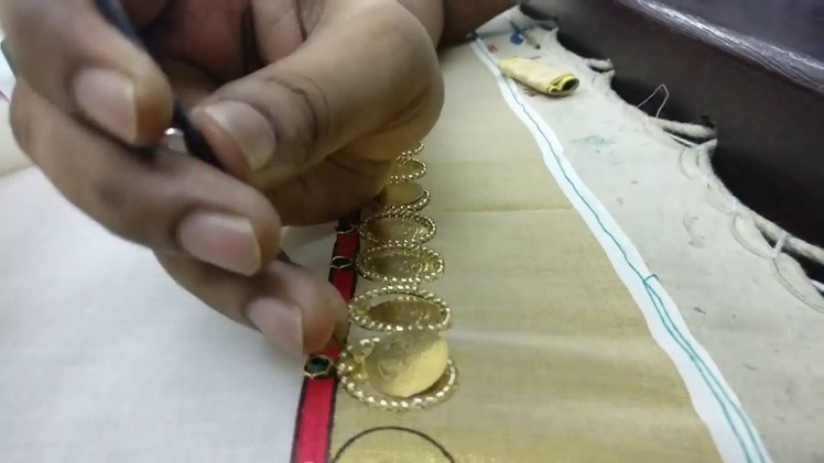 Coin design for a saree border