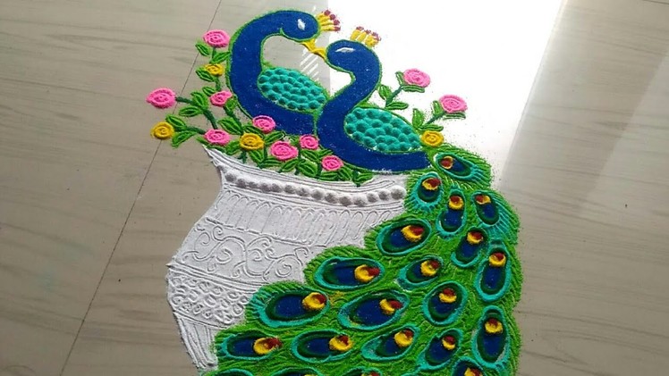 How to make beautiful couple peacock rangoli designs.peacock rangoli design easy by jyoti