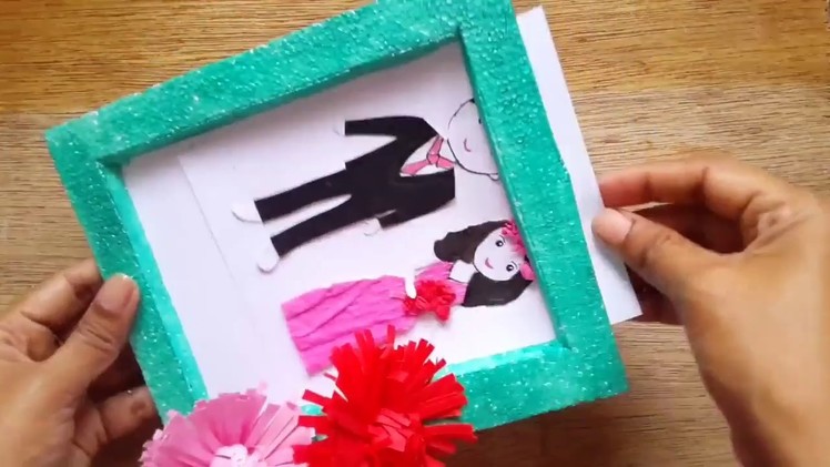 DIY photo frame made by thermocol and it's decorated with DIY paper flowers