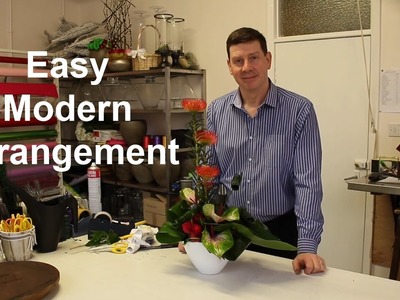 Modern flower arrangement with rolled leaf detail - ideal for home or in work situations -