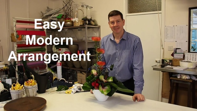 Modern flower arrangement with rolled leaf detail - ideal for home or in work situations -