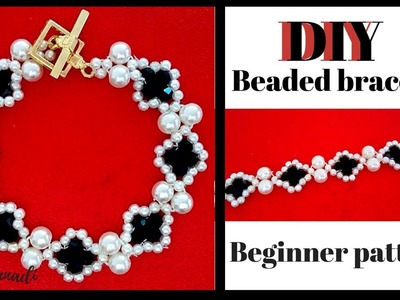 Make a beaded bracelet with white and black beads. Jewelry making tutorial