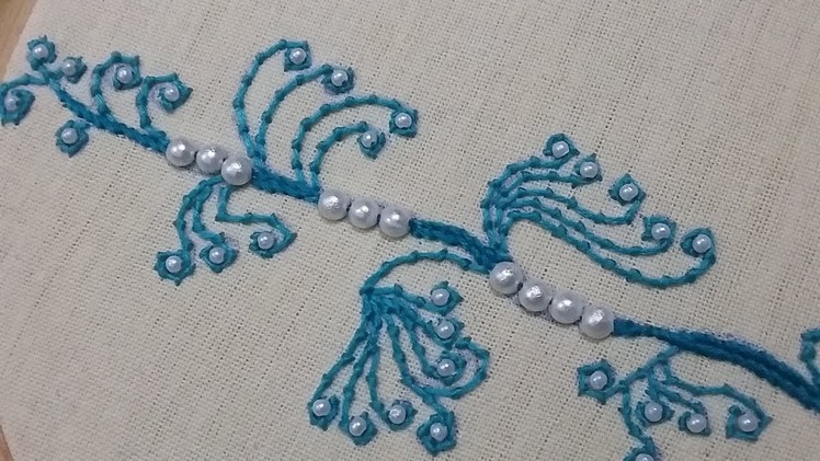 Hand embroidery using coral stitch and pearls