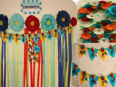 Simple second birthday decoration with paper.backdrop with paper flowers.mom and aditya