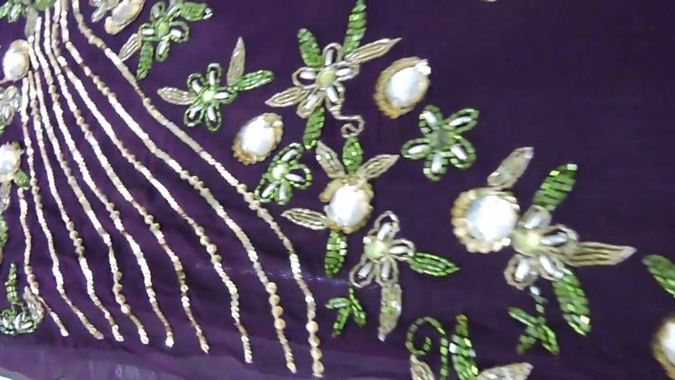 HAND EMBROIDERY WITH GLASS CUTS BEADS STITCHED BY THREAD.